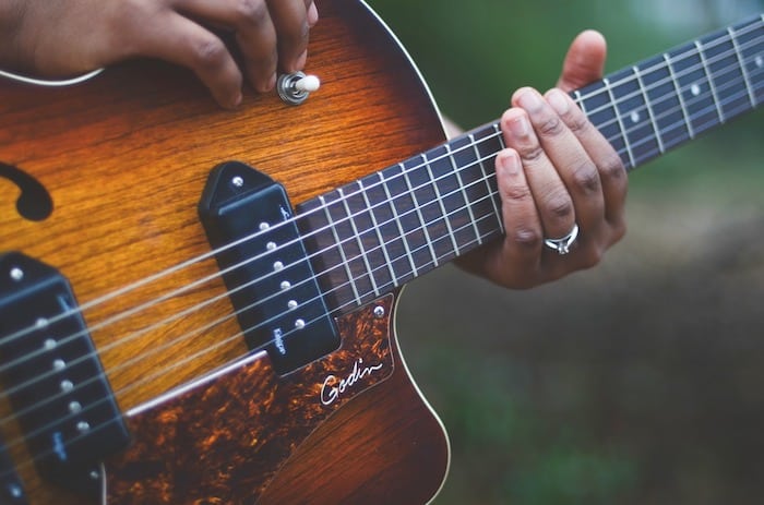 acoustic electric guitars under guitar looking popular musicians