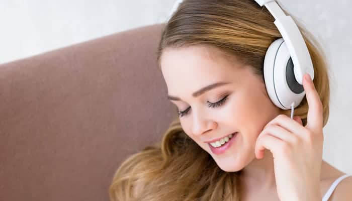 Girl with headphone listening to music
