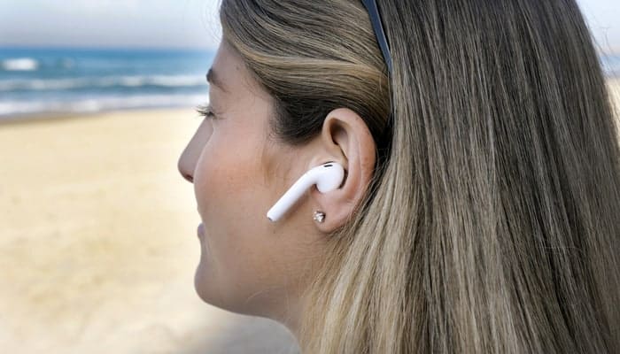 Woman with wireless earbuds