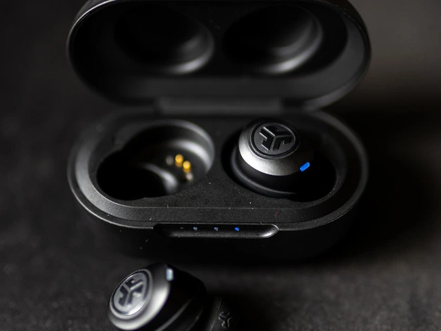 Open case with one JLab earbud