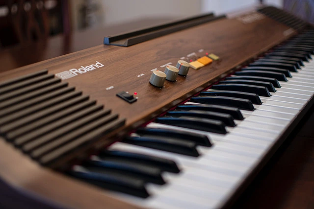 A modern digital piano with 88 keys.