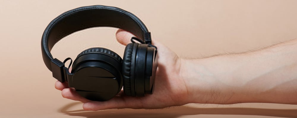 Headphone on a person's palm