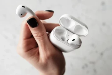 holding an airpods
