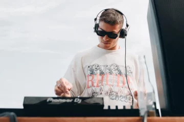 A DJ wearing a pair of DJ headphones