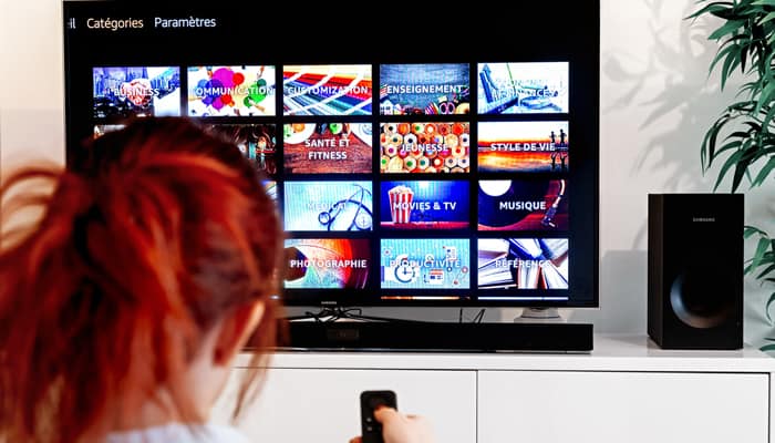 Redhead woman watching tv