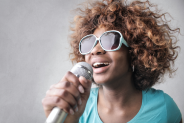 a woman hold a microphone