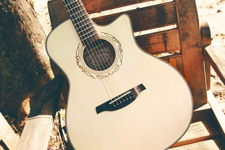 white cutaway acoustic guitar