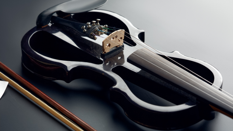 electric violin on black table