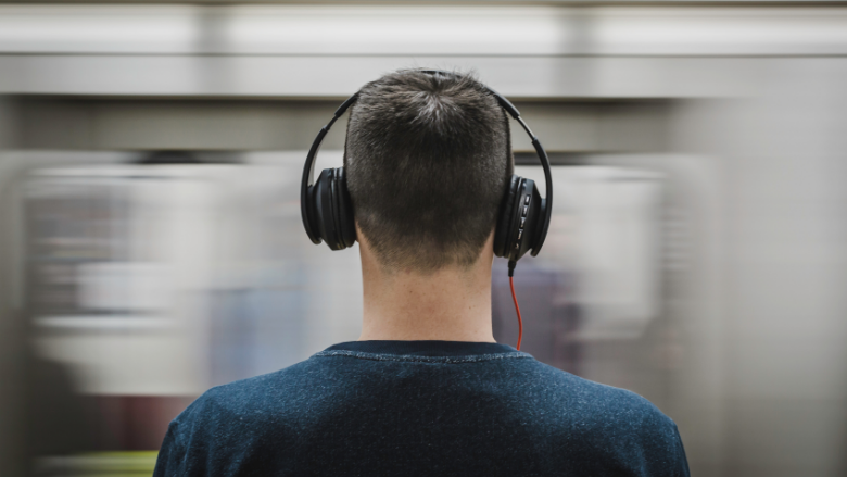 man in the subway wearing a headphone