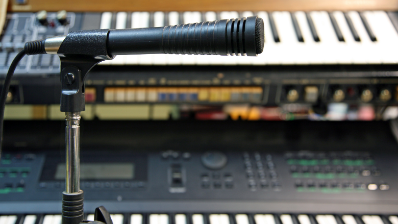 microphone and synthesizer setup in a studio