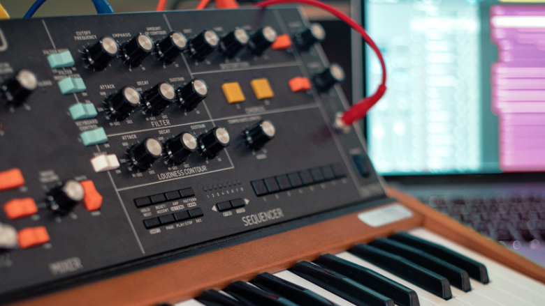 moog synthesizer on a wooden desk