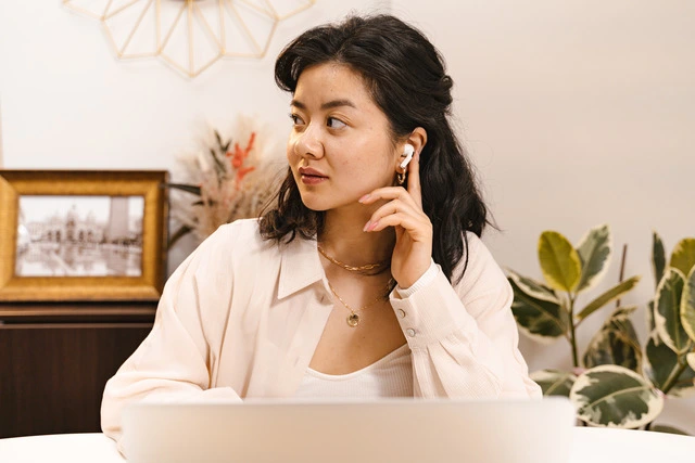 a woman wearing an airpods