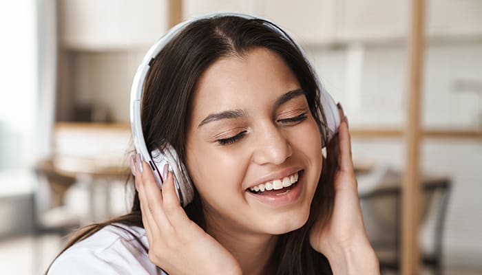 Woman with wireless headphone