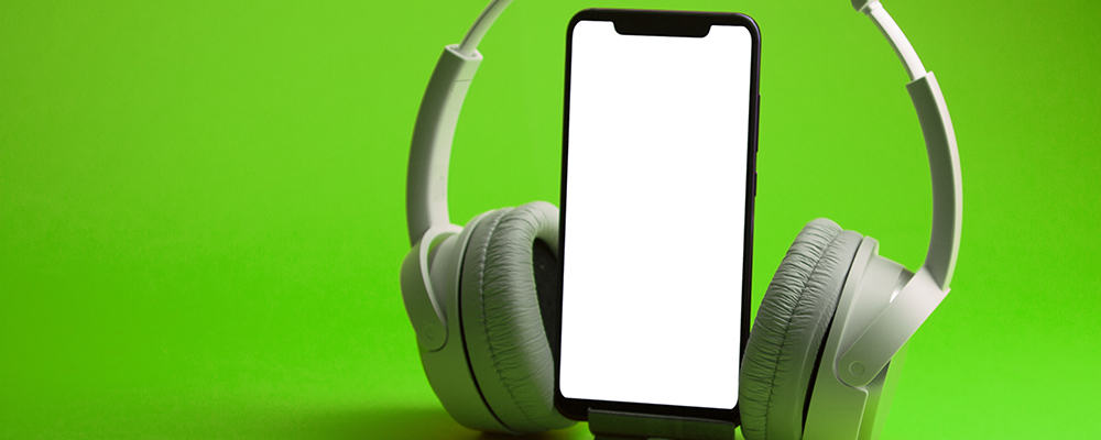 White headphones on smartphone