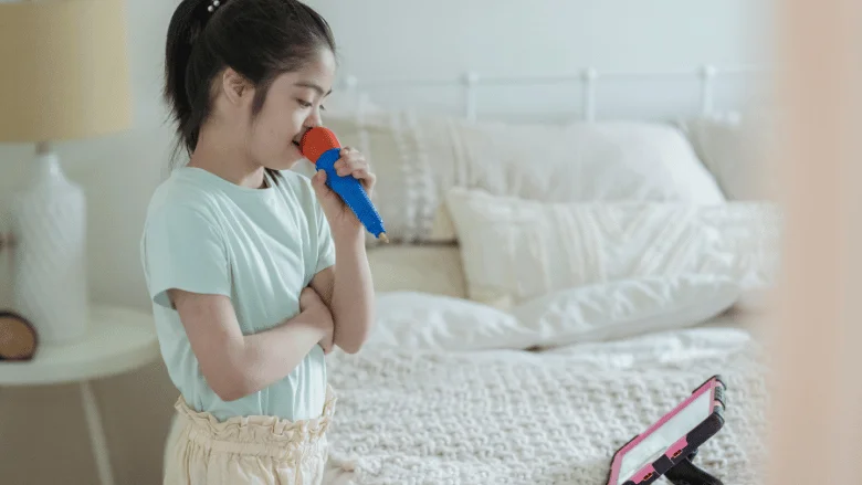 young girl singing with best karaoke machines